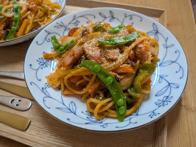 Napolitan Japanese ketchup spaghetti on a plate with parmesan cheese
