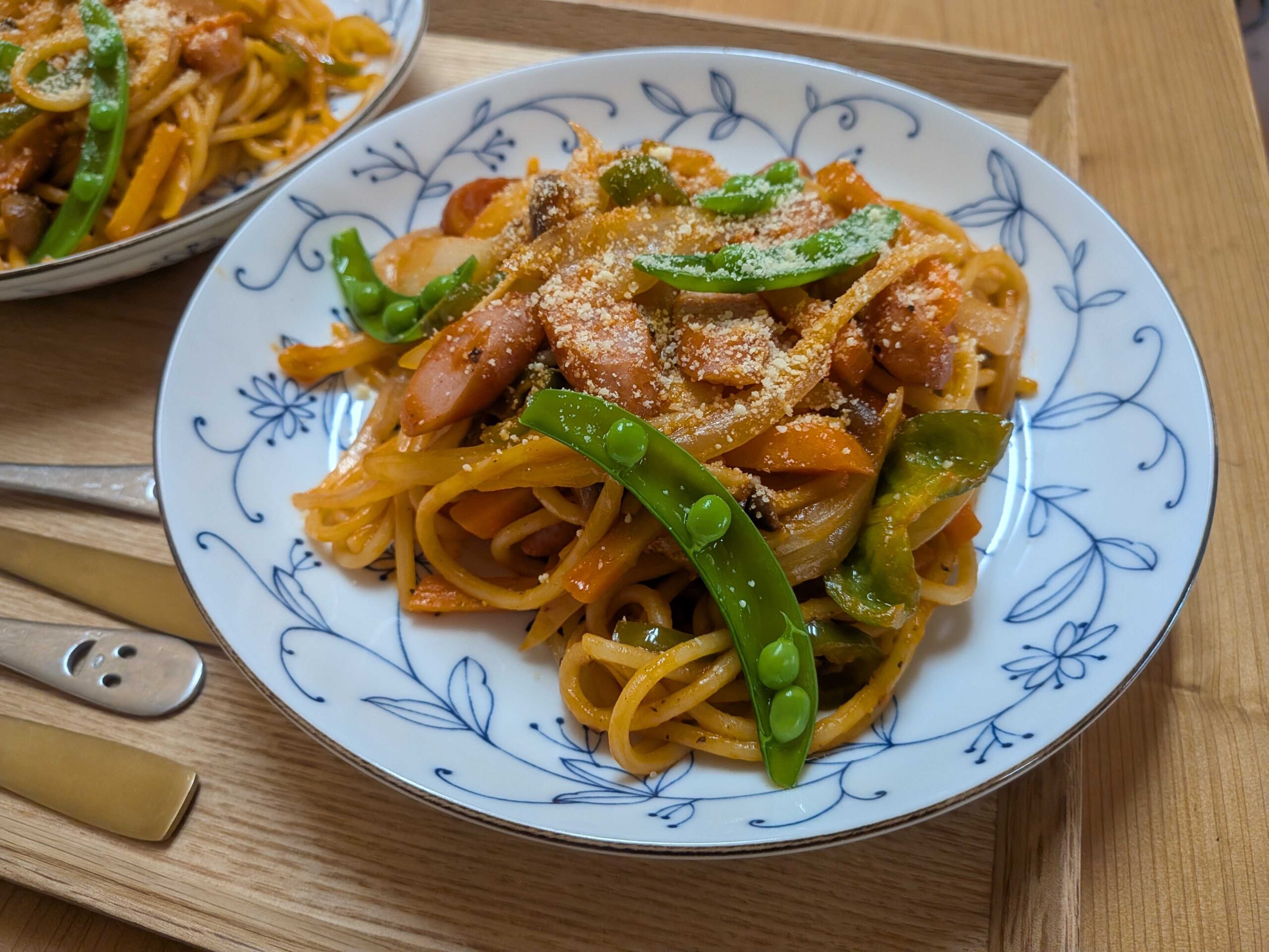 Napolitan Japanese ketchup spaghetti on a plate with parmesan cheese