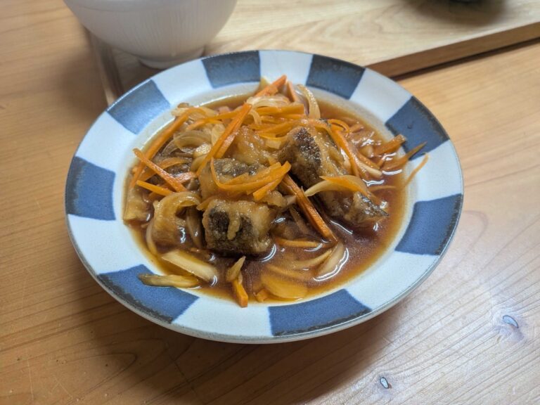 Nanban zuke served in a Japanese bowl with carrot, onion and sweet sour sauce