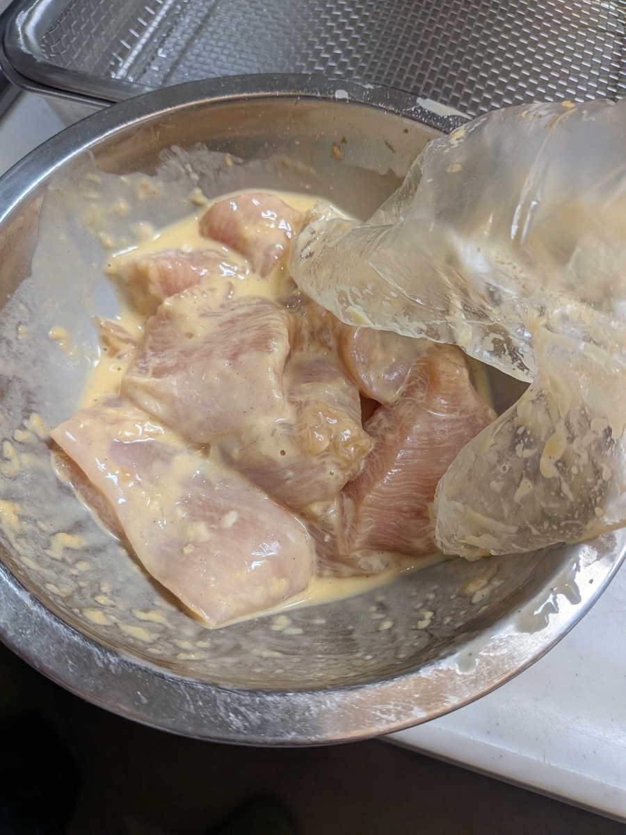 Chicken pieces coated in tempura batter ready for frying