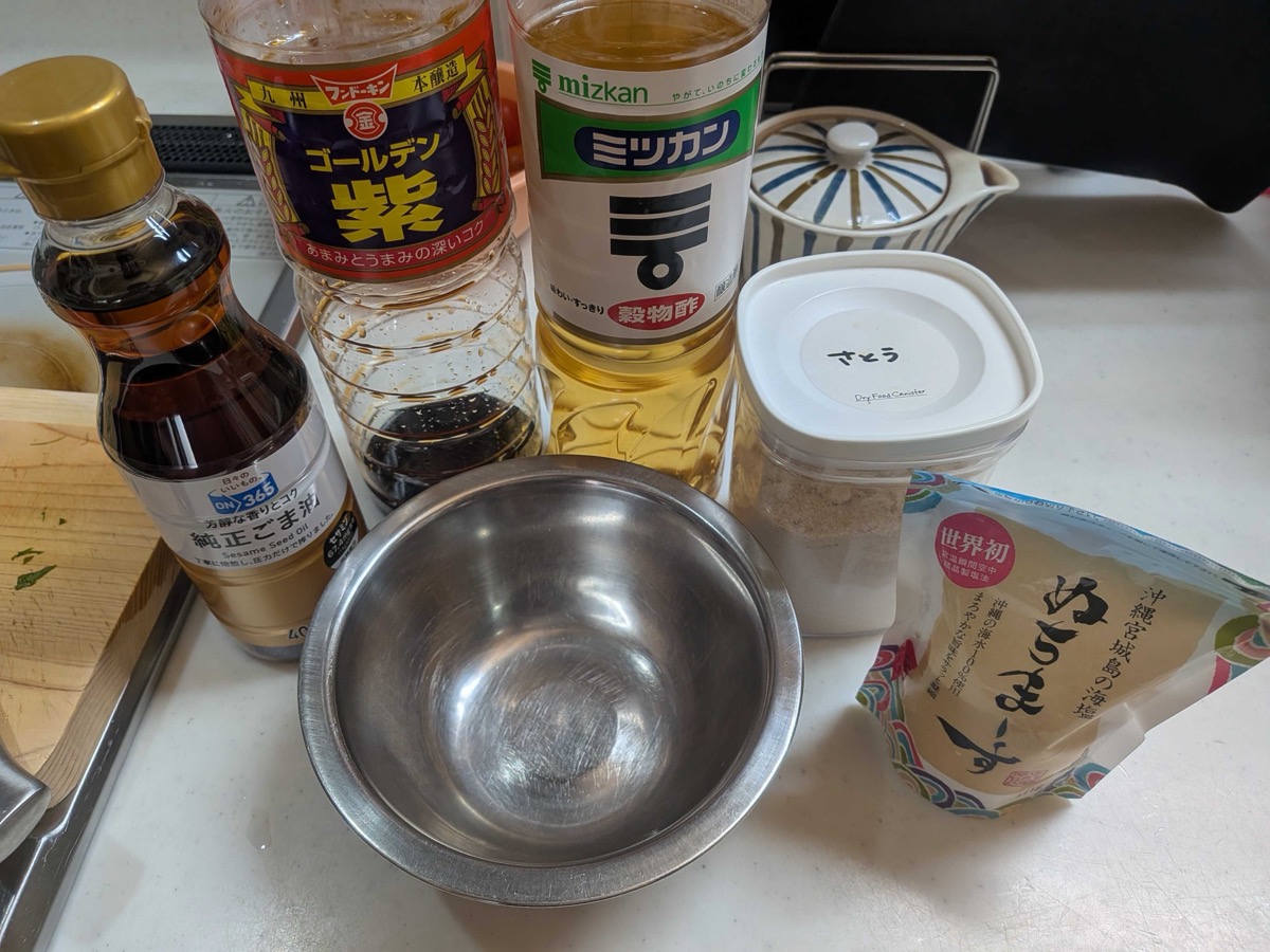 Dressing ingredients — soy sauce, rice vinegar, sesame oil, sugar, and salt laid out with a mixing bowl