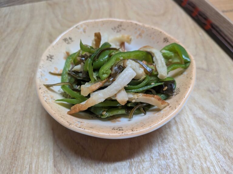A small dish of Japanese green pepper and chikuwa namul with shio kombu and sesame seeds