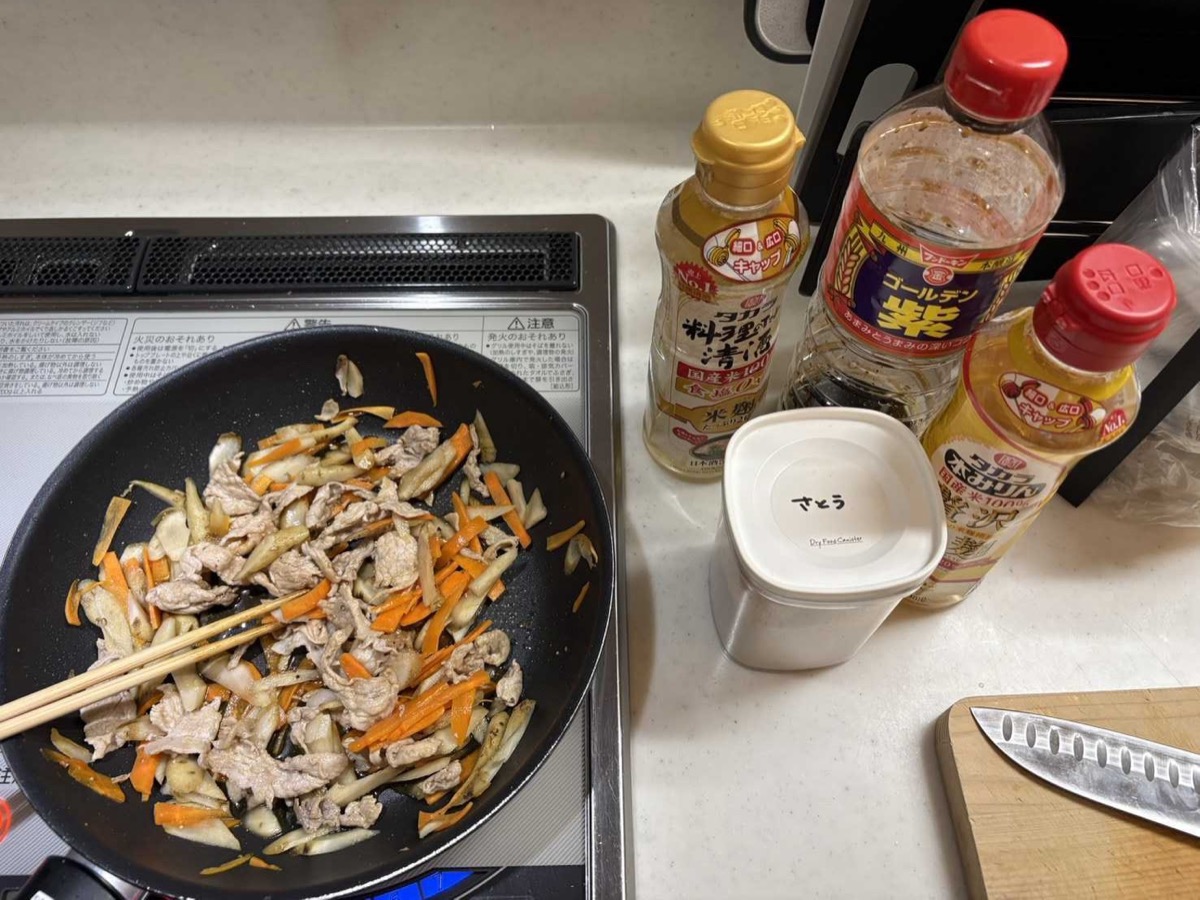 The soy-mirin sauce added to the pork and vegetables in the pan