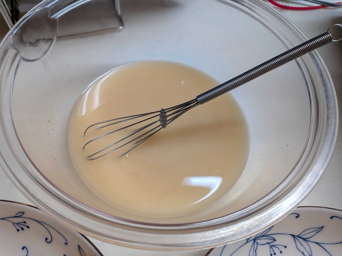 Ankake soup base whisked smooth with water in a glass bowl