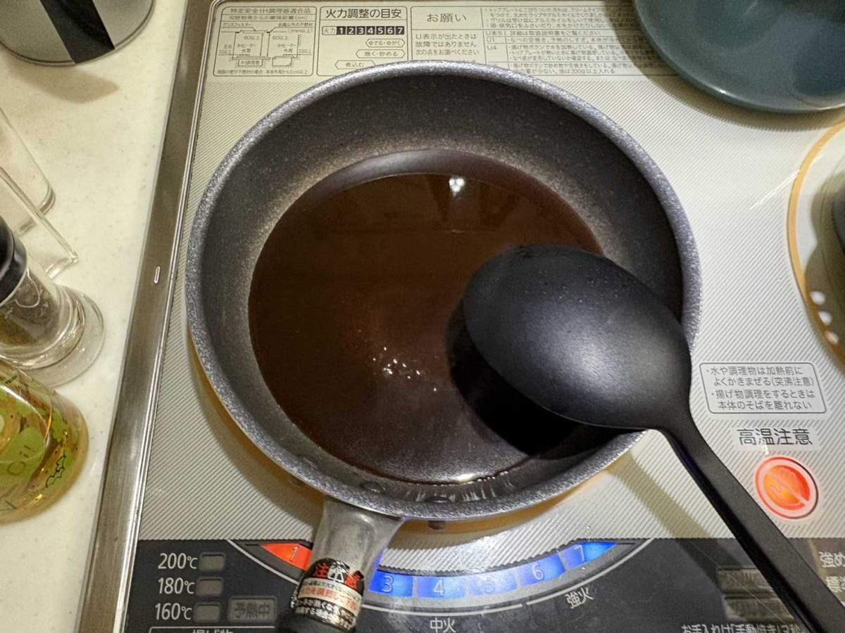Katsudon sauce simmering in a small saucepan