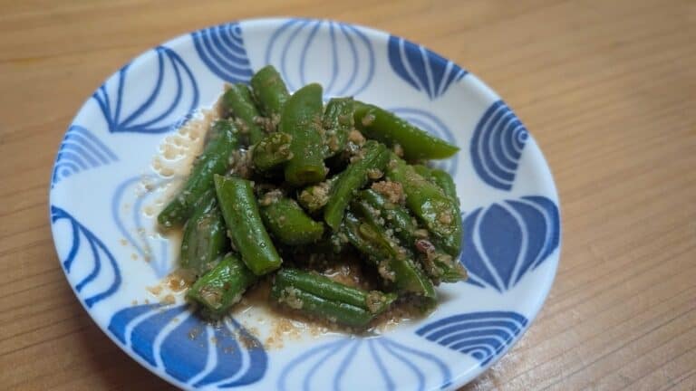 Goma ae green beans — Japanese sesame green beans on a blue-and-white plate