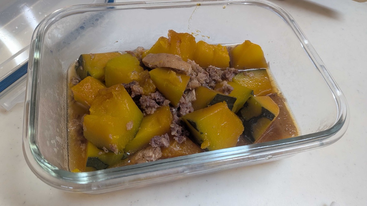Leftover kabocha no nimono stored in a glass container for meal prep