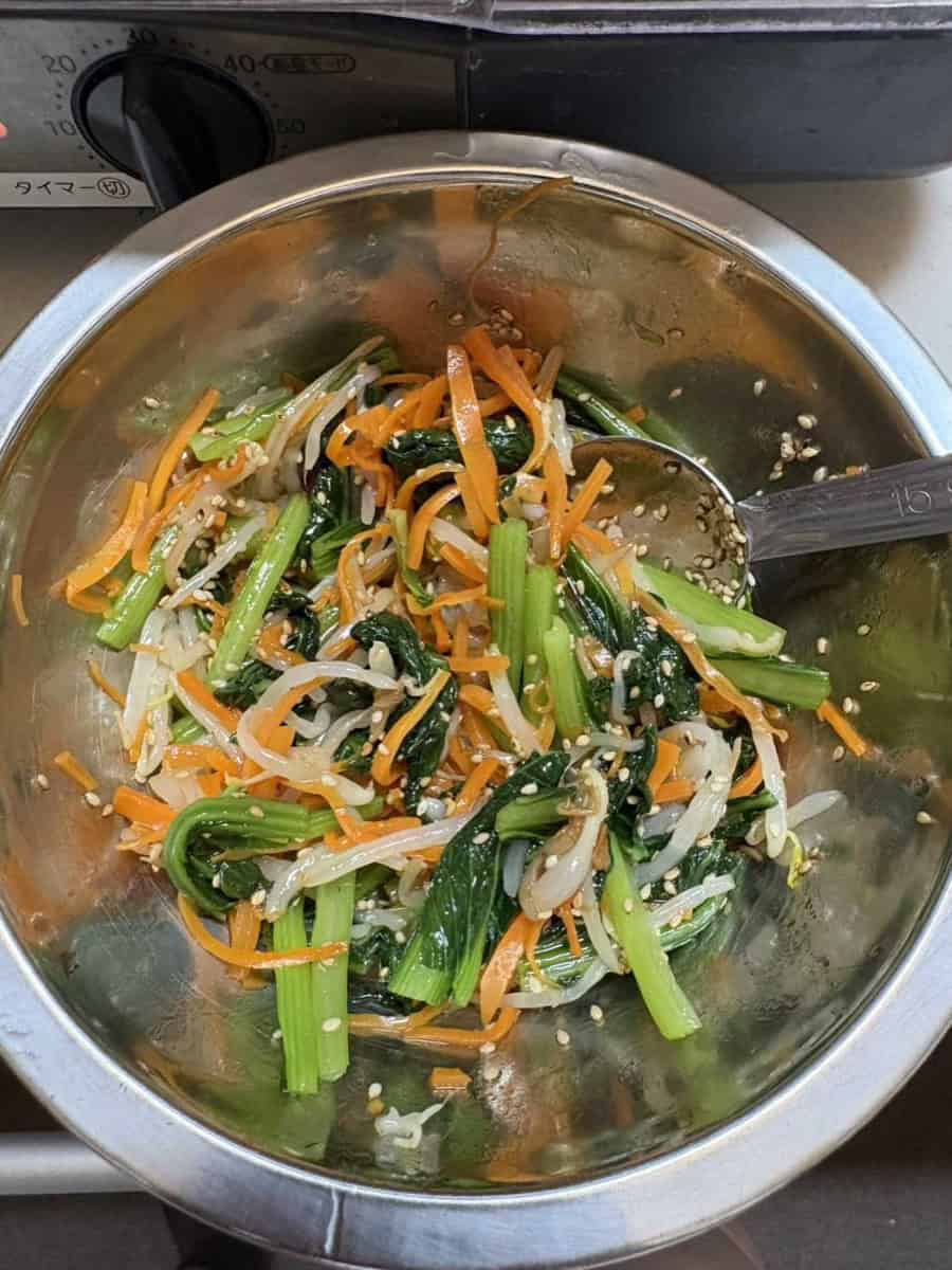 Finished three-color namul tossed with sesame in a metal bowl
