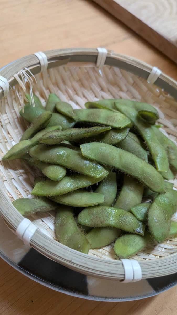 Close-up of boiled edamame pods showing the fine hairs and bright green color