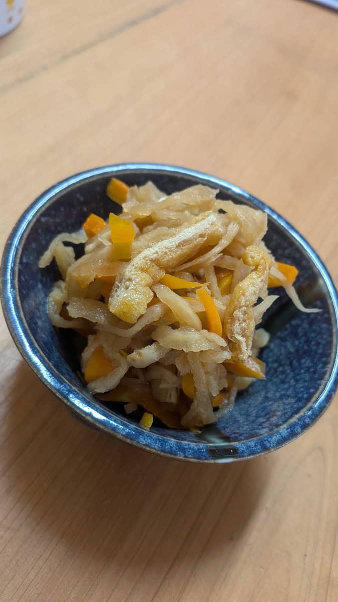 Kiriboshi daikon — Japanese simmered dried daikon radish with carrot and fried tofu, served in a small blue bowl