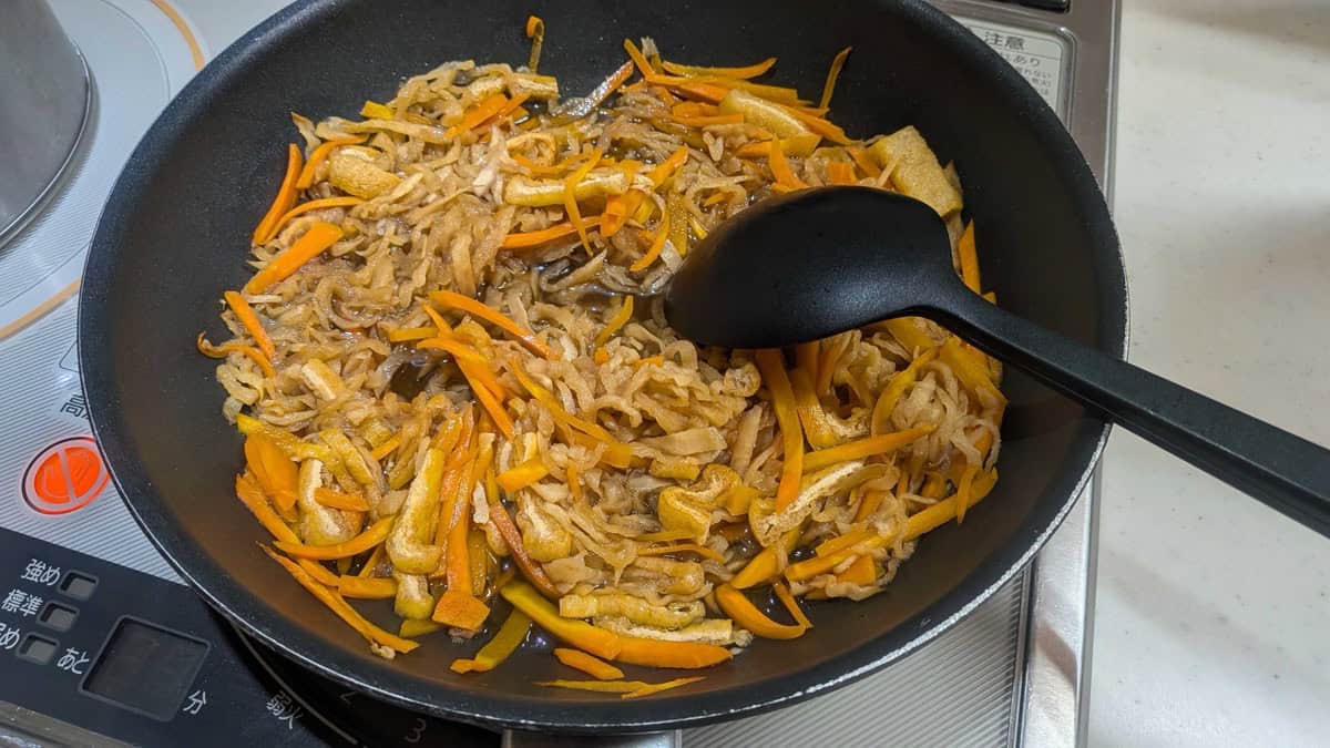 Finished kiriboshi daikon in the pan with the broth reduced and glossy