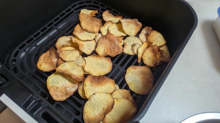 Air fryer Japanese sweet potato chips — thin golden chips with caramelized edges in the air fryer basket