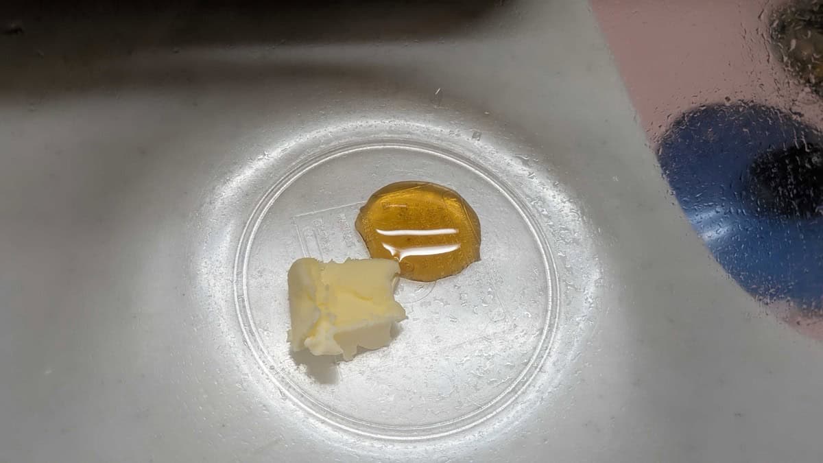 Honey and a knob of butter in a glass dish before melting in the microwave